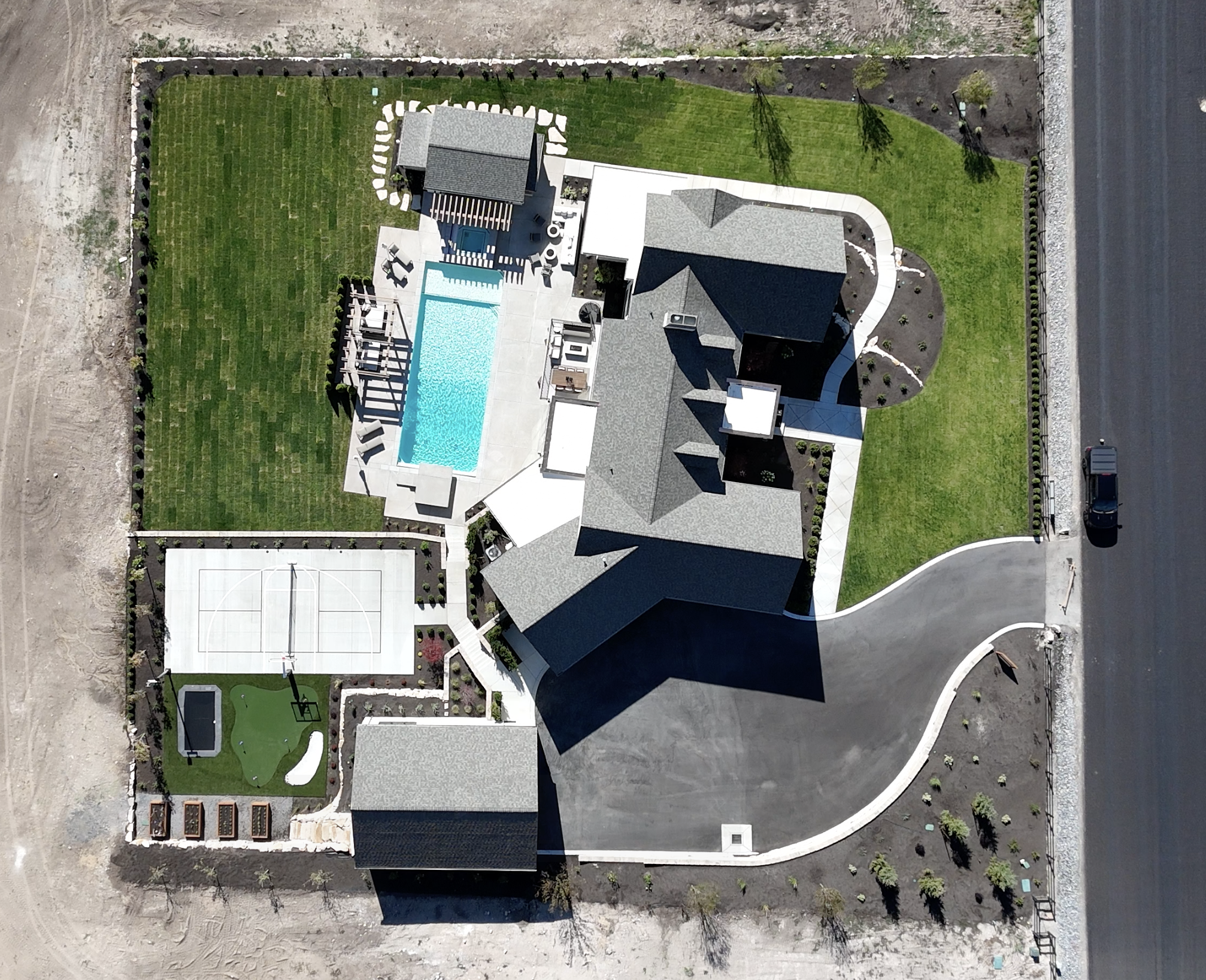 Top-down aerial view of Hawthorne luxury home in Alpine, Utah showing pool and grounds